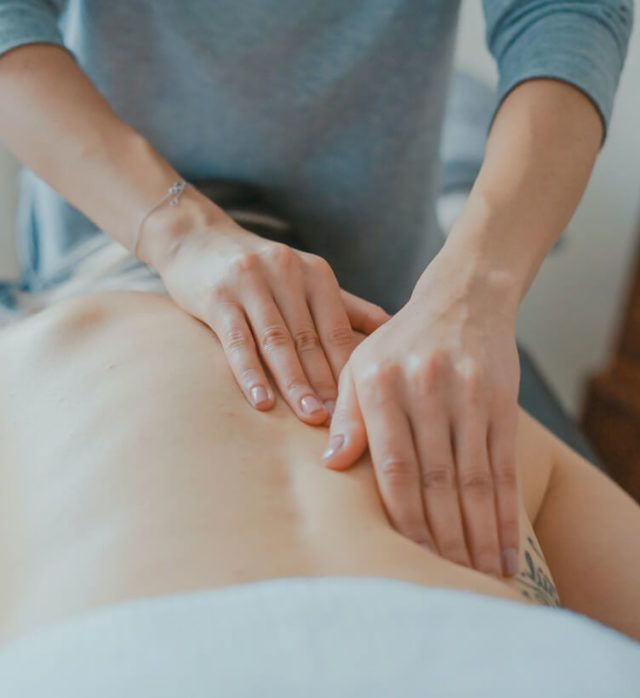 A patient receiving a massage